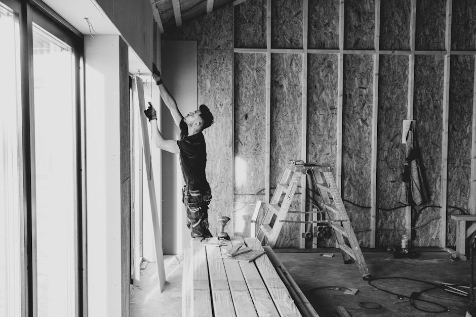 Dedicated window installation professional reviewing plans